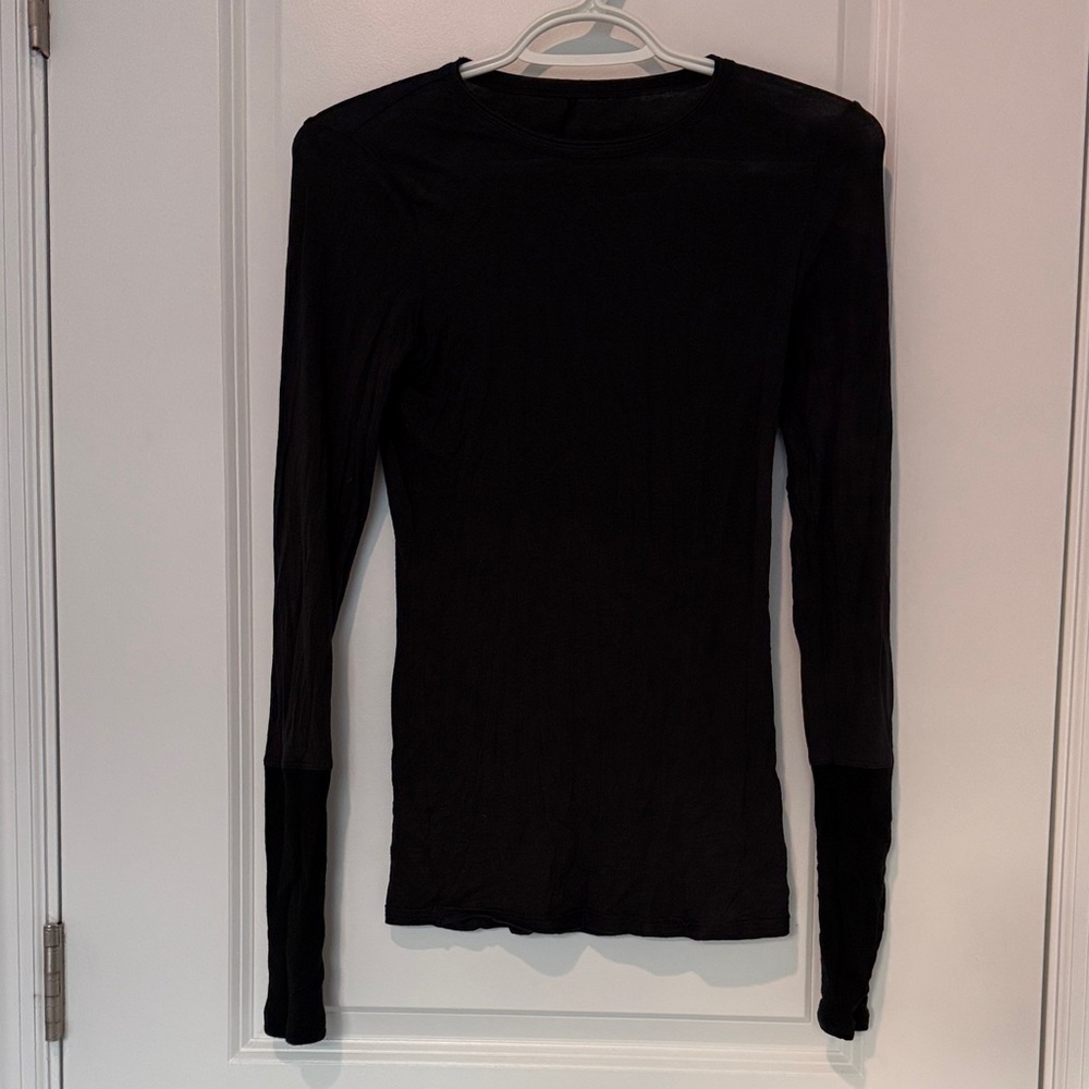 Lulu lemon black long sleeve shirt. Size 0. Like new. Ultra stretchy thin warm.